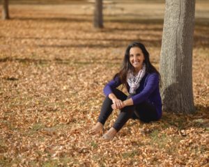 Photo of Paula Pant near a tree in fall